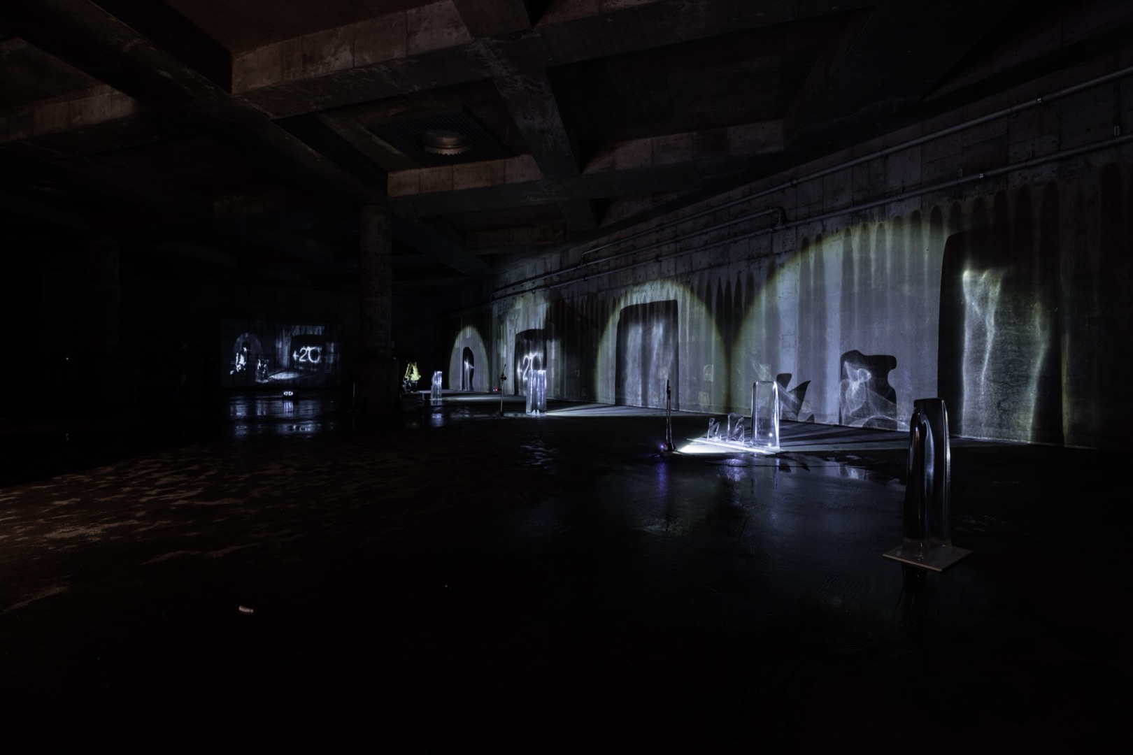 Wide view of venue with caustic light patterns projected across walls